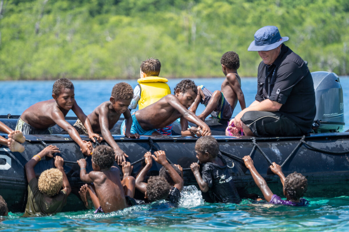 Frigate Island South Pacific kids swimming