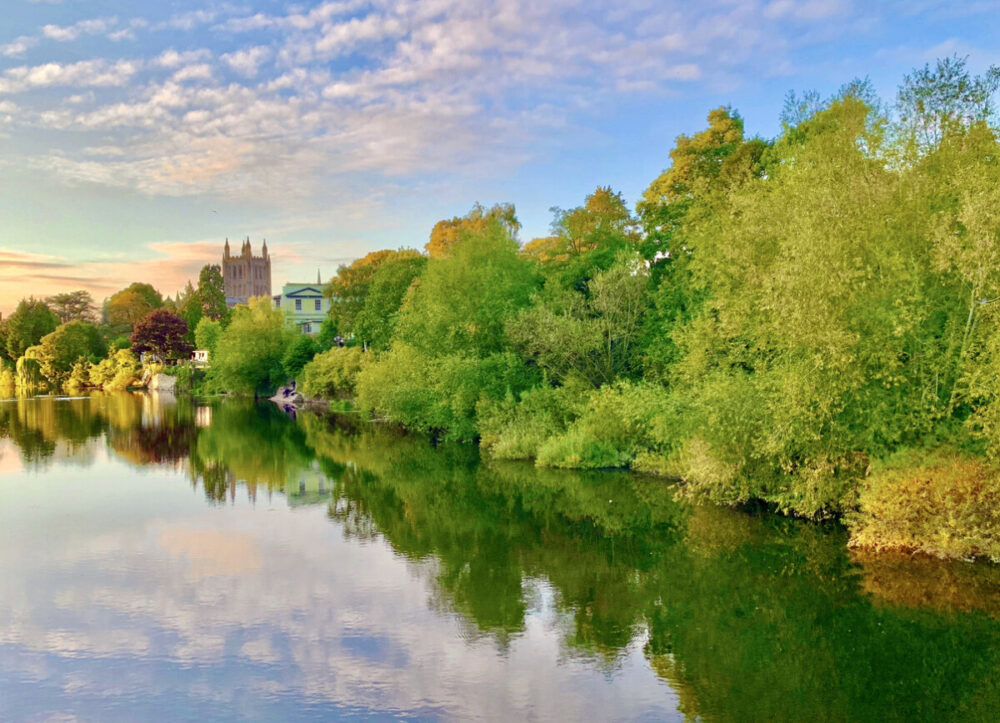 A beautiful scenic view of the River Wye in Hereford, UK at sunset.