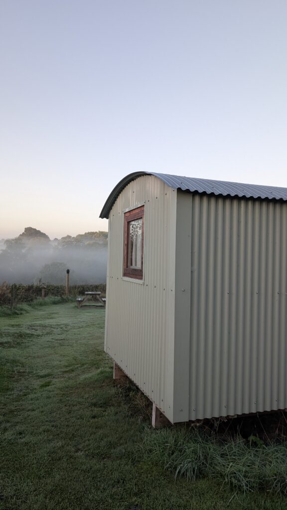 Early morning exterior shot of Dragon's Hut glamping in Wrexham