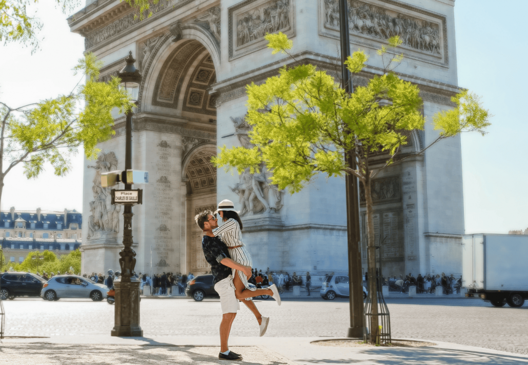 Couple on a citytrip in Paris visiting Avenue des Champs-Elysees Paris France Arc De Triomphe