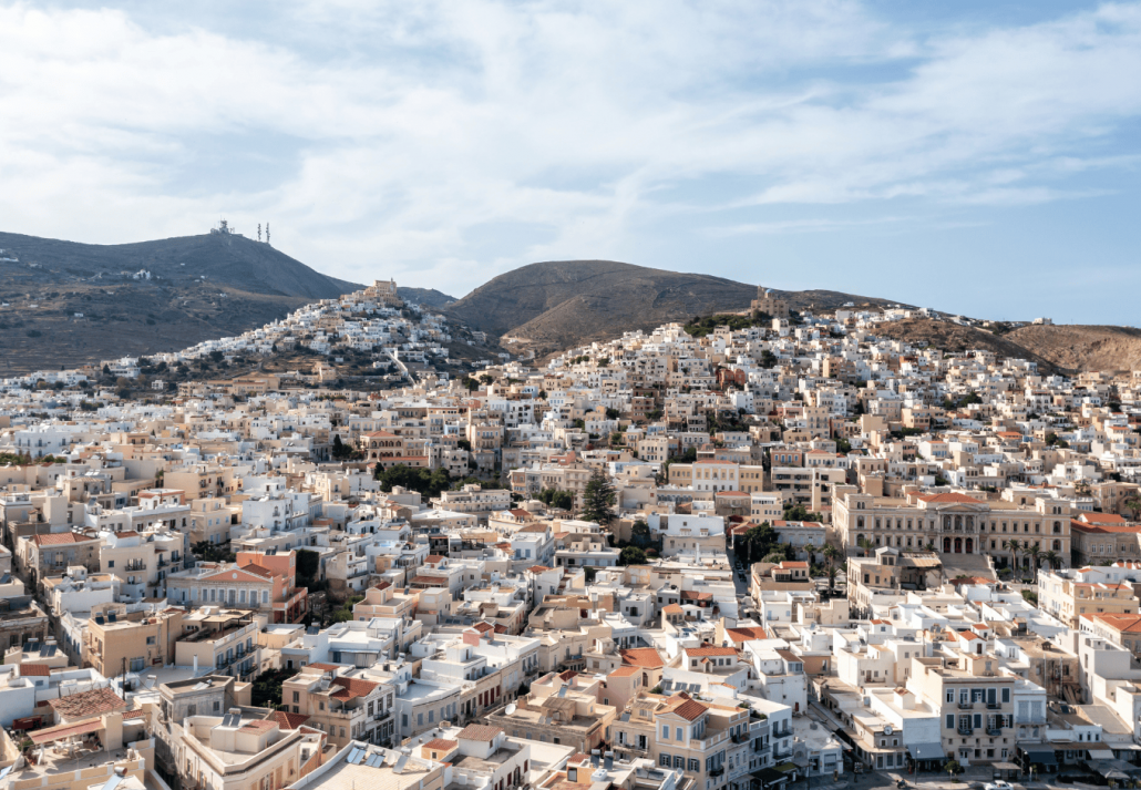 Syros island, Greece, aerial drone view. Ermoupolis and Ano Siros town cityscape