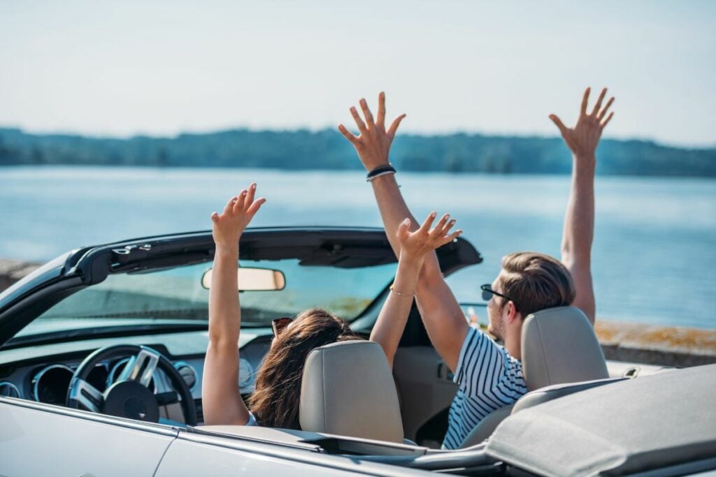 Couple riding in car together - Cheap Vacations for Couples