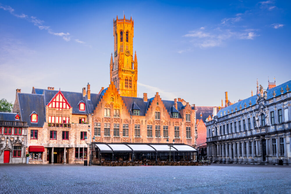 Bruges, Belgium. Burg, downtown medieval square with famous Belfry tower, Flanders travel destination.